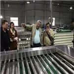 Indonesian customers watching the mangosteen processing machine